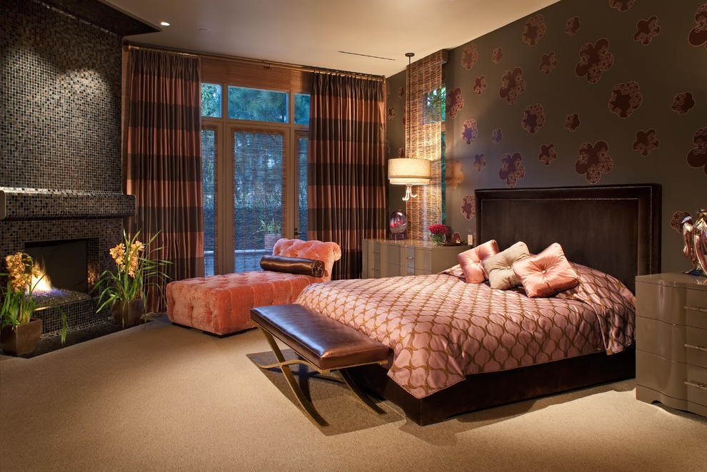 This is an example of a modern bedroom in San Diego with multi-coloured walls, carpet and a corner fireplace.