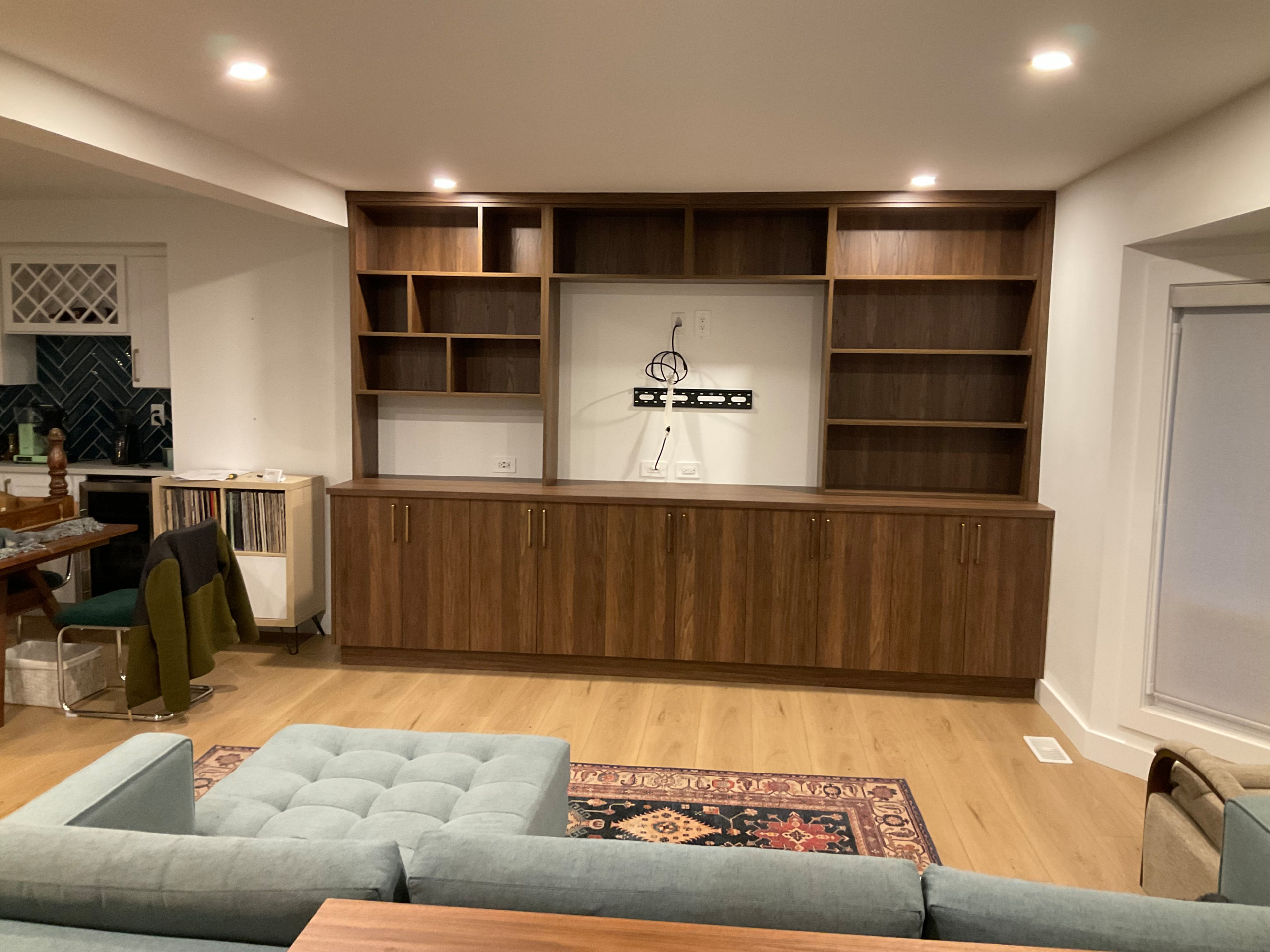 Contemporary media console with storage cabinets and integrated TV mount area