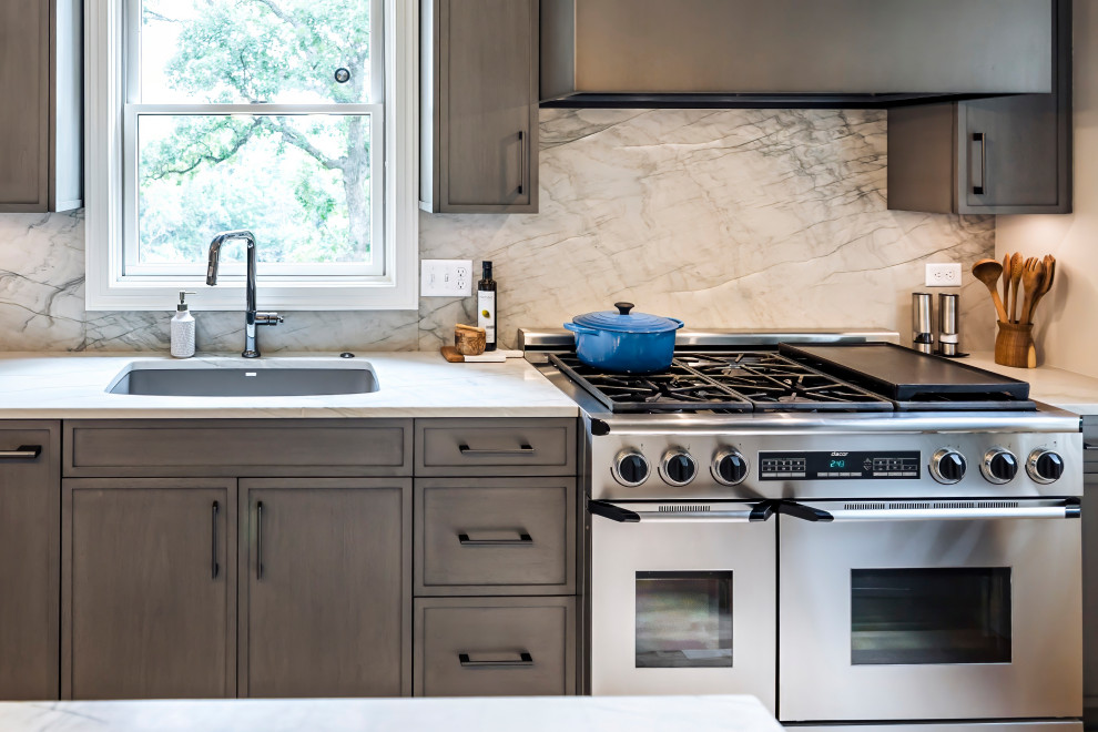 Inspiration for a mid-sized transitional l-shaped light wood floor and beige floor eat-in kitchen remodel with an undermount sink, raised-panel cabinets, brown cabinets, wood countertops, white backsplash, stone slab backsplash, stainless steel appliances, an island and white countertops