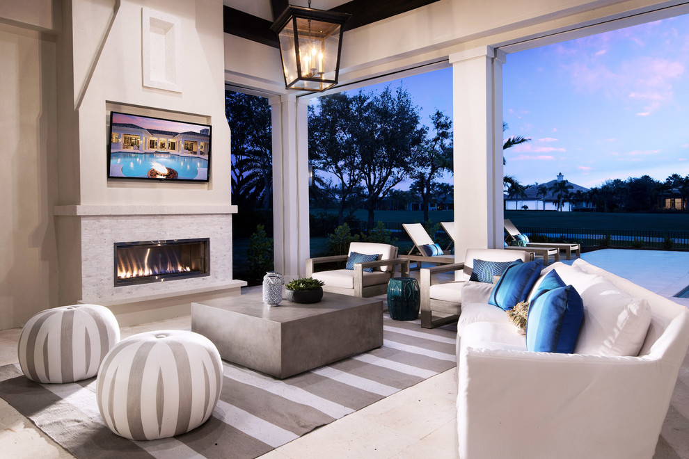 Beach style patio photo with a fireplace