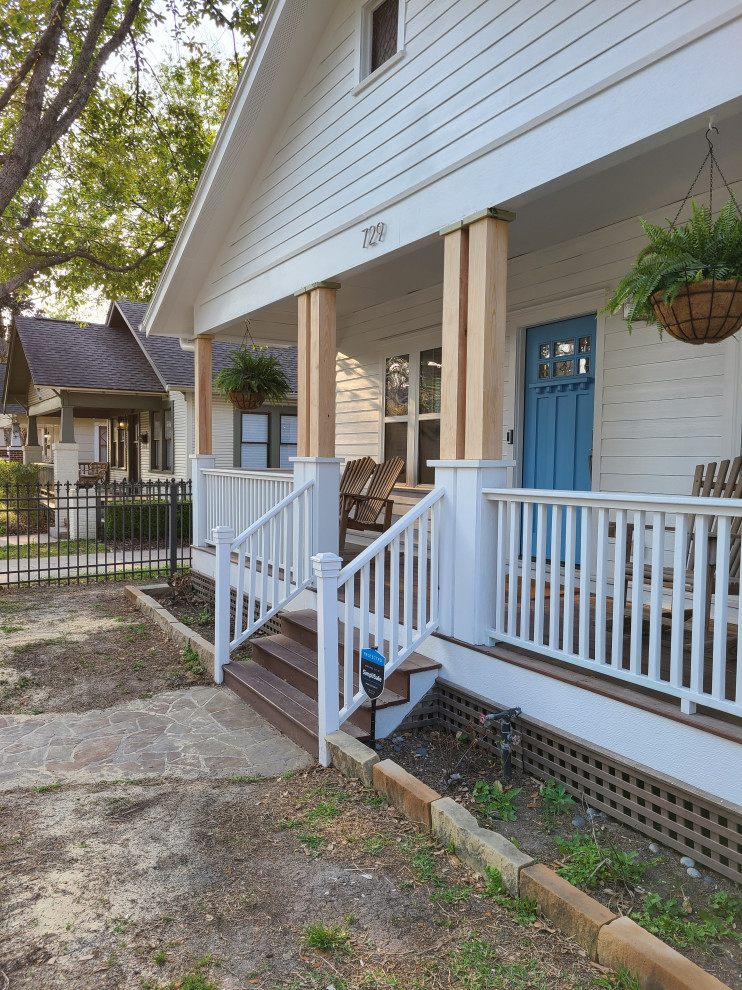 Inspiration for a small craftsman wood railing porch remodel in Houston with decking and an awning