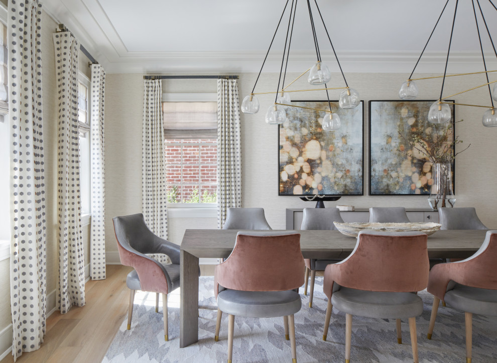 Example of a large transitional medium tone wood floor, brown floor and wallpaper dining room design in New York