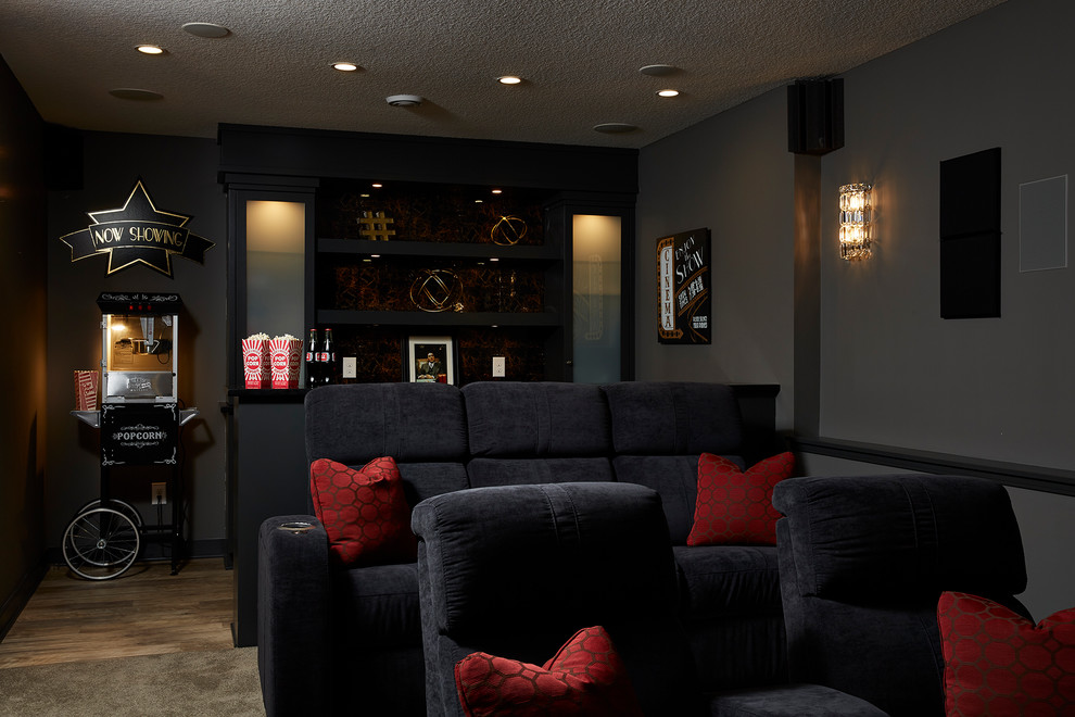 Design ideas for a medium sized traditional enclosed home cinema in Minneapolis with grey walls and a wall mounted tv.