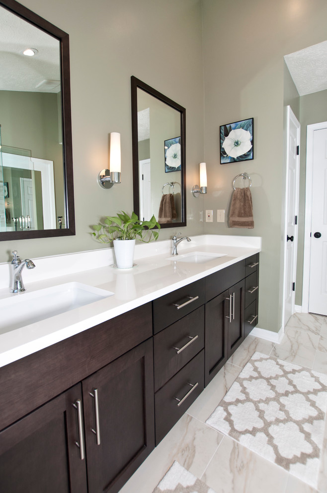 Design ideas for a mid-sized transitional master bathroom in Nashville with an undermount sink, flat-panel cabinets, dark wood cabinets, engineered quartz benchtops, a corner shower, a two-piece toilet, white tile, porcelain tile, green walls and porcelain floors.