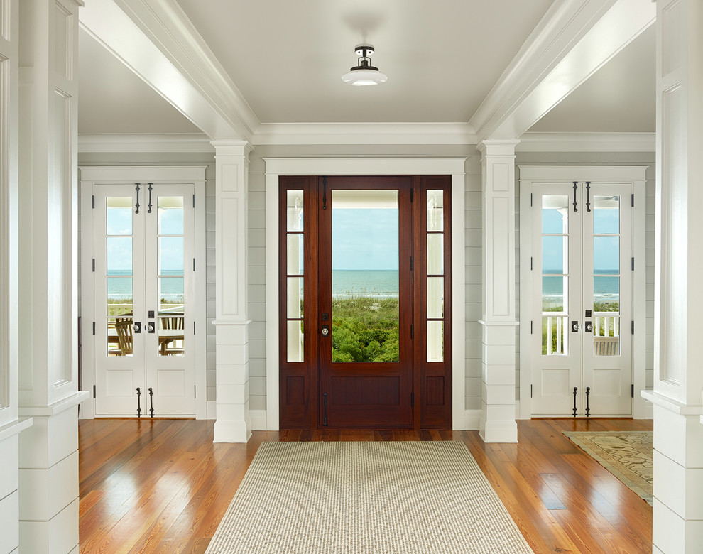 Beach style front door in Charleston with a single front door and a dark wood front door.