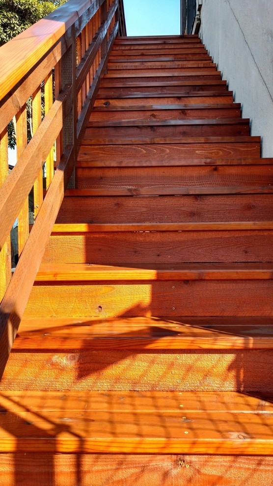 Mid-sized transitional side yard deck photo with no cover