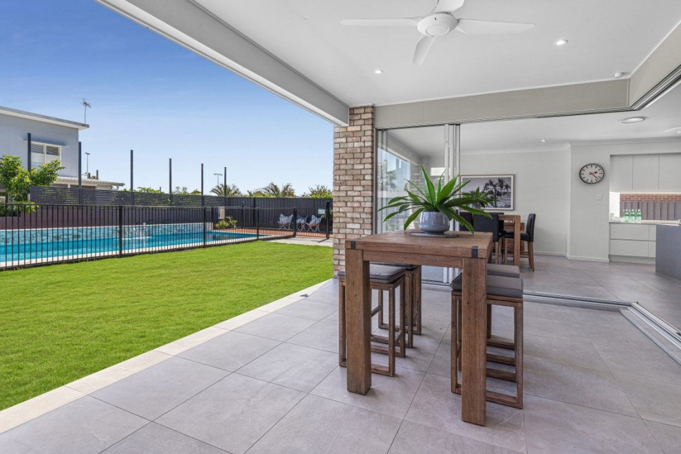 This is an example of a large contemporary patio in Brisbane.