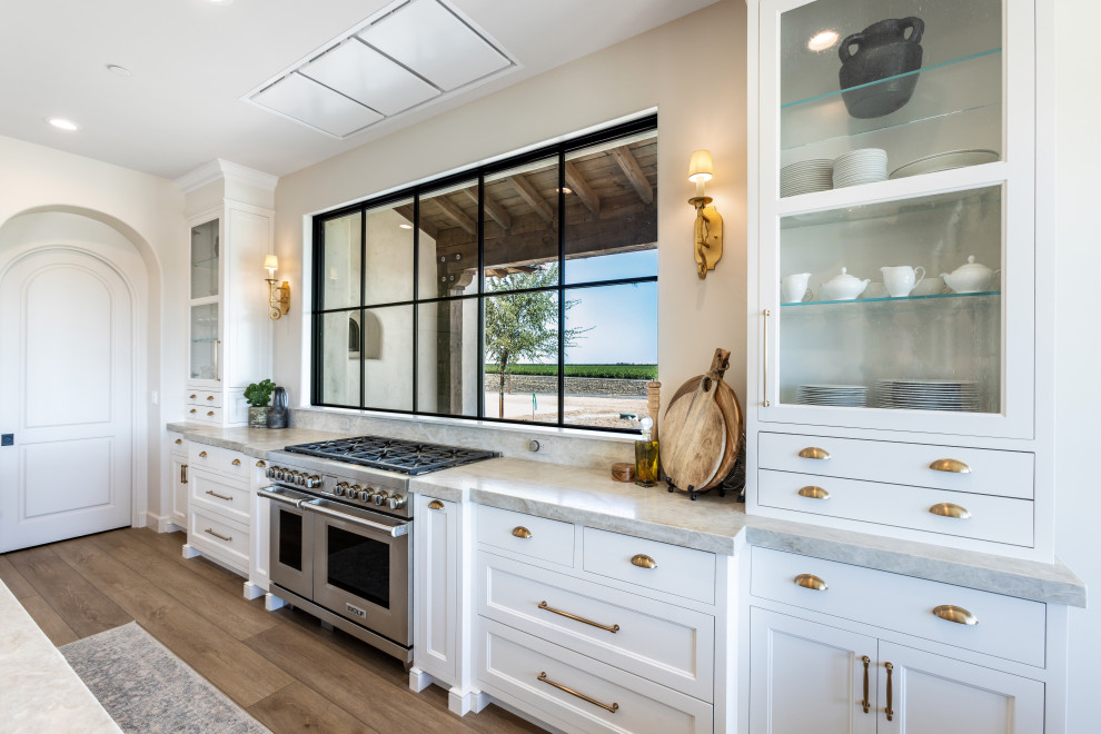 Kitchen Range Wall with Glass Display Cabinetry | Tuscan Farmhouse