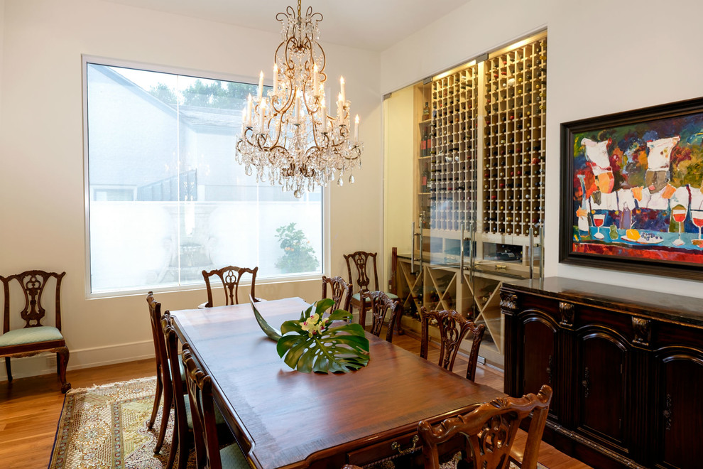 Mid-sized traditional separate dining room in Dallas with white walls, light hardwood floors and no fireplace.
