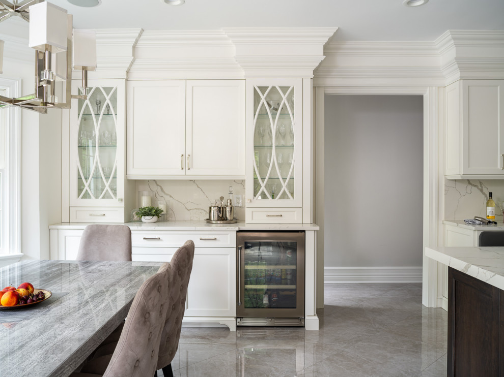 Design ideas for a large traditional l-shaped kitchen in New York with a submerged sink, flat-panel cabinets, white cabinets, engineered stone countertops, white splashback, engineered quartz splashback, marble flooring and white worktops.