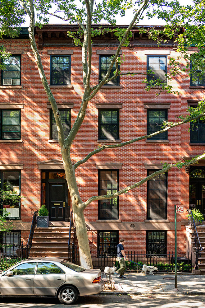 Inspiration for a traditional three-storey brick townhouse exterior in New York.