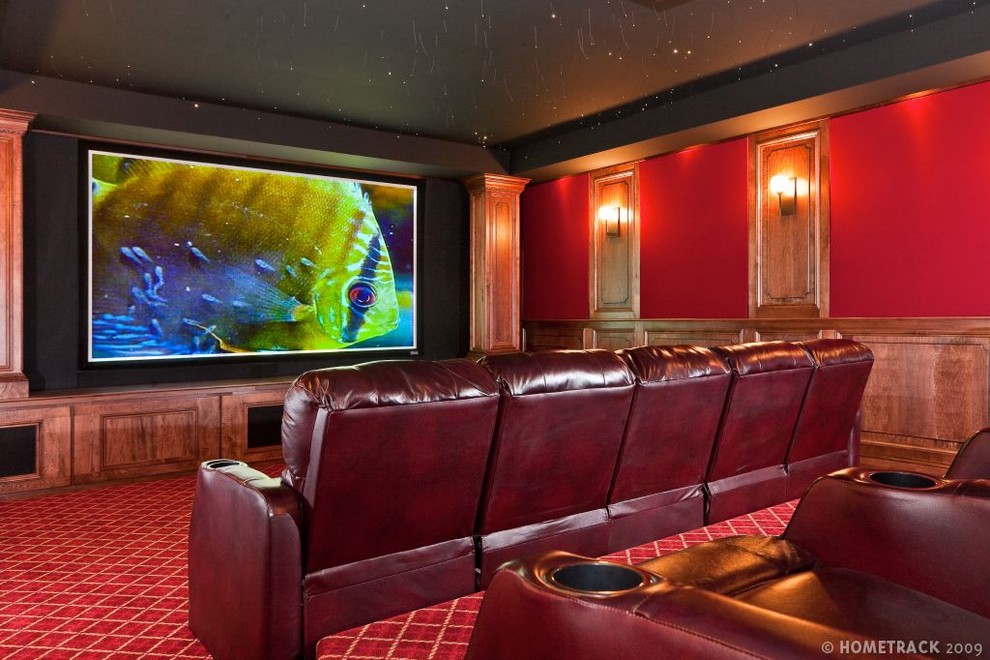 Photo of a large transitional enclosed home theatre in Baltimore with red walls, carpet, a built-in media wall and red floor.