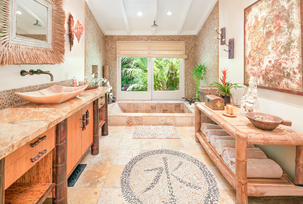 This is an example of a large asian 3/4 bathroom in Santa Barbara with flat-panel cabinets, dark wood cabinets, an open shower, a two-piece toilet, brown tile, stone tile, brown walls, pebble tile floors, a trough sink and granite benchtops.