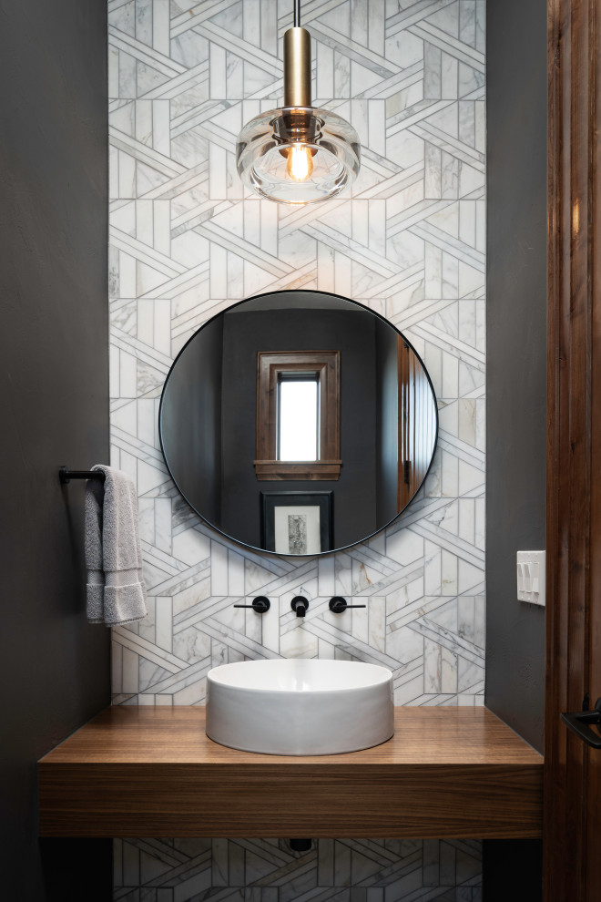 Inspiration for a small contemporary powder room in Denver with gray tile, porcelain tile, grey walls, a vessel sink, wood benchtops, brown benchtops and a floating vanity.