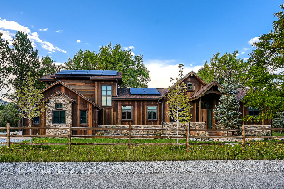 Example of a mountain style brown two-story wood gable roof design in Denver with a shingle roof and a brown roof
