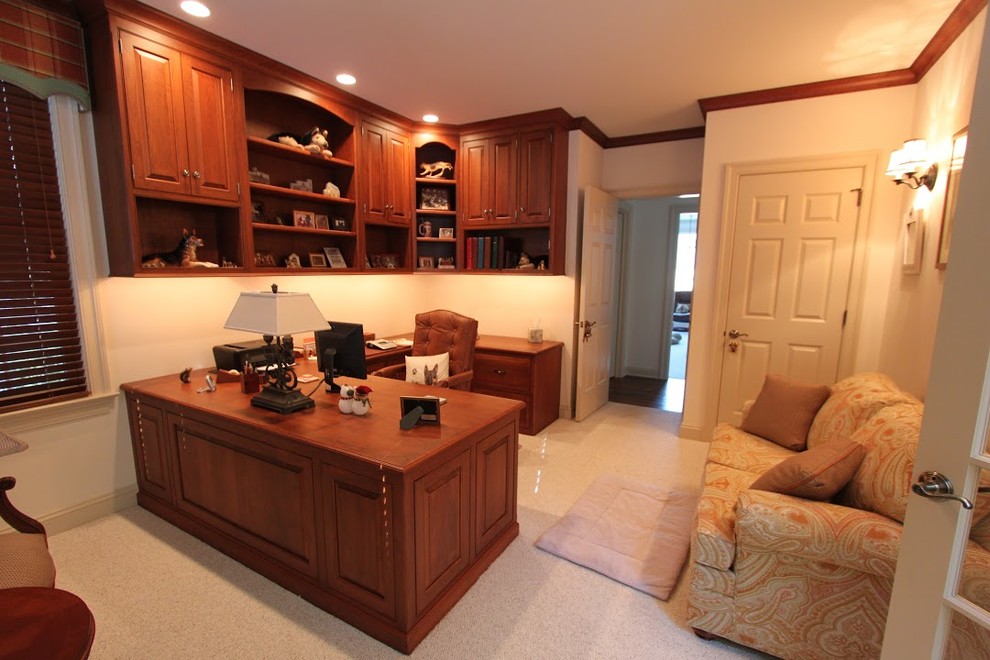 Mid-sized transitional study room in Other with white walls, carpet, no fireplace and a built-in desk.