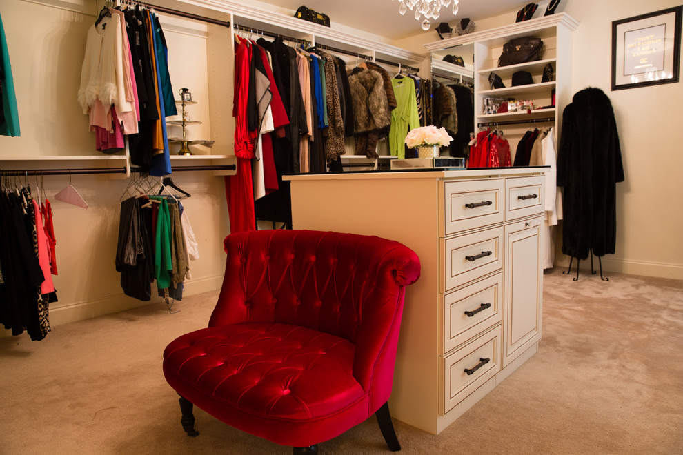 Photo of a large eclectic women's walk-in wardrobe in Atlanta with raised-panel cabinets, white cabinets and carpet.