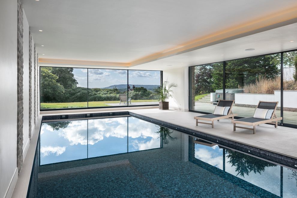 Photo of a mid-sized transitional rectangular lap pool.