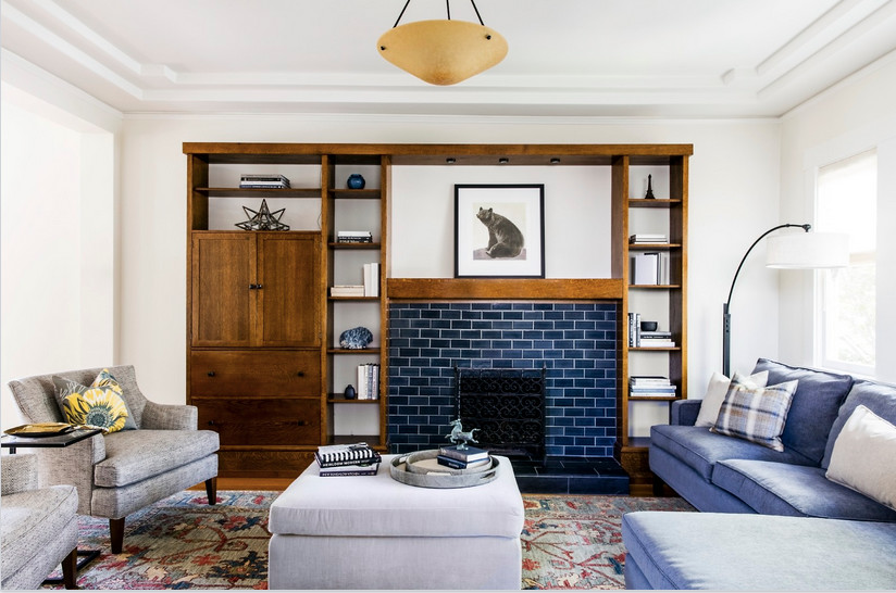 This is an example of a mid-sized arts and crafts formal open concept living room in San Francisco with white walls, light hardwood floors, a standard fireplace, a tile fireplace surround and no tv.