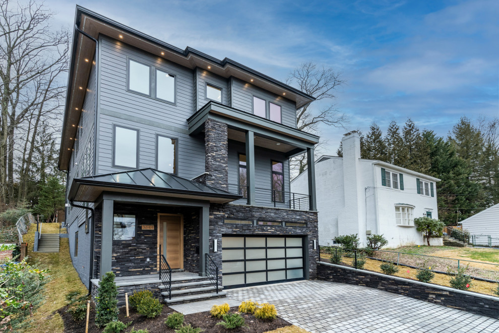Mittelgroßes, Zweistöckiges Modernes Haus mit grauer Fassadenfarbe und Flachdach in Sonstige