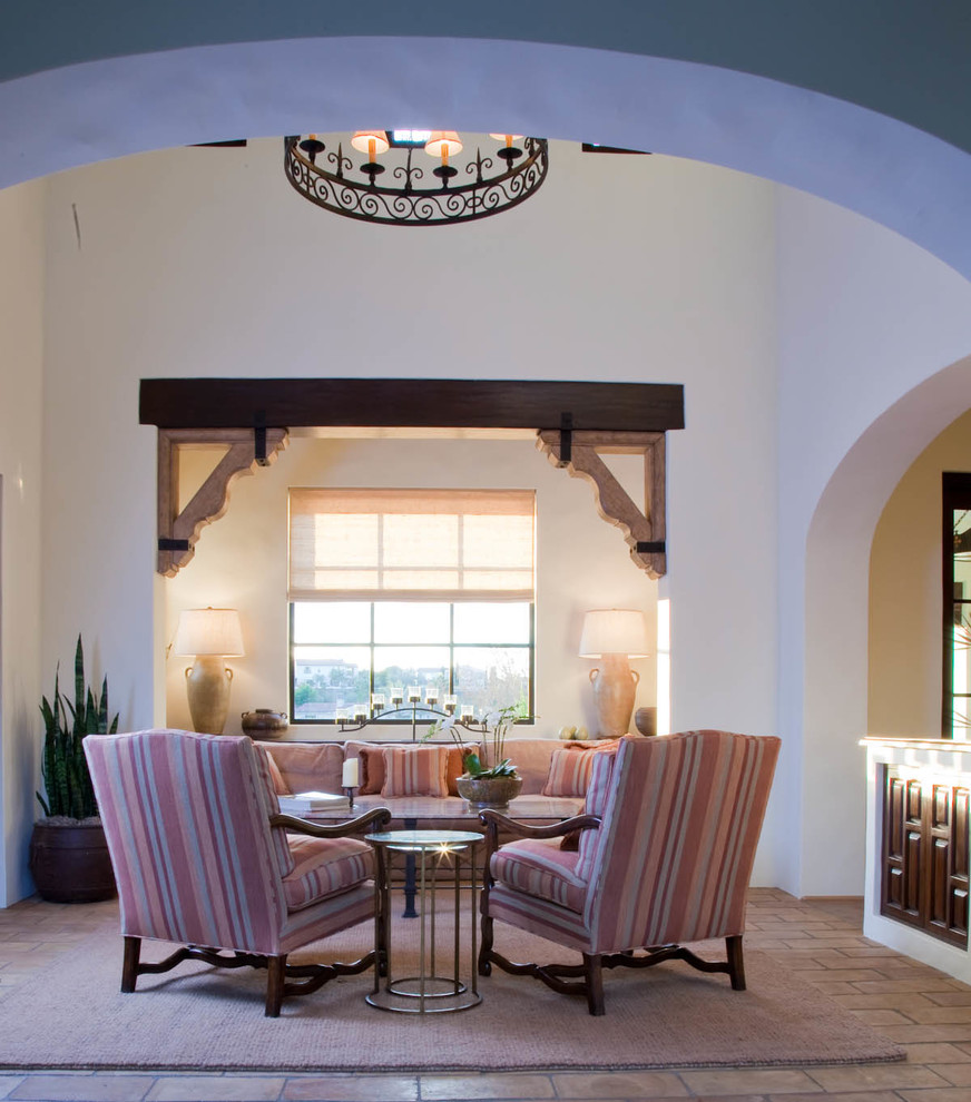Inspiration for a mediterranean living room in San Diego with white walls.