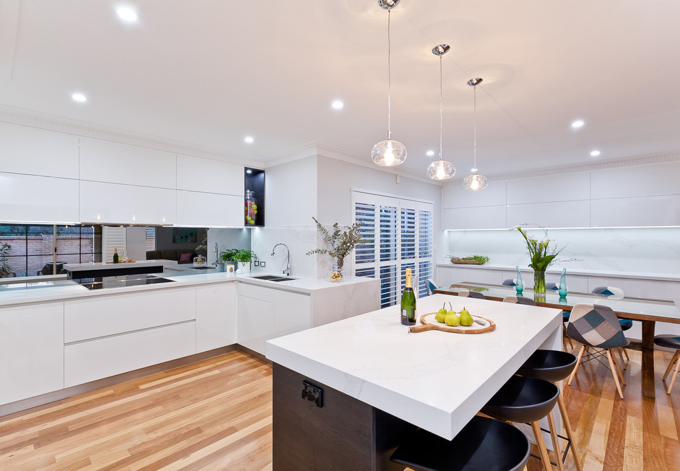 Inspiration for a contemporary kitchen in Perth with an undermount sink, flat-panel cabinets, white cabinets, medium hardwood floors and with island.