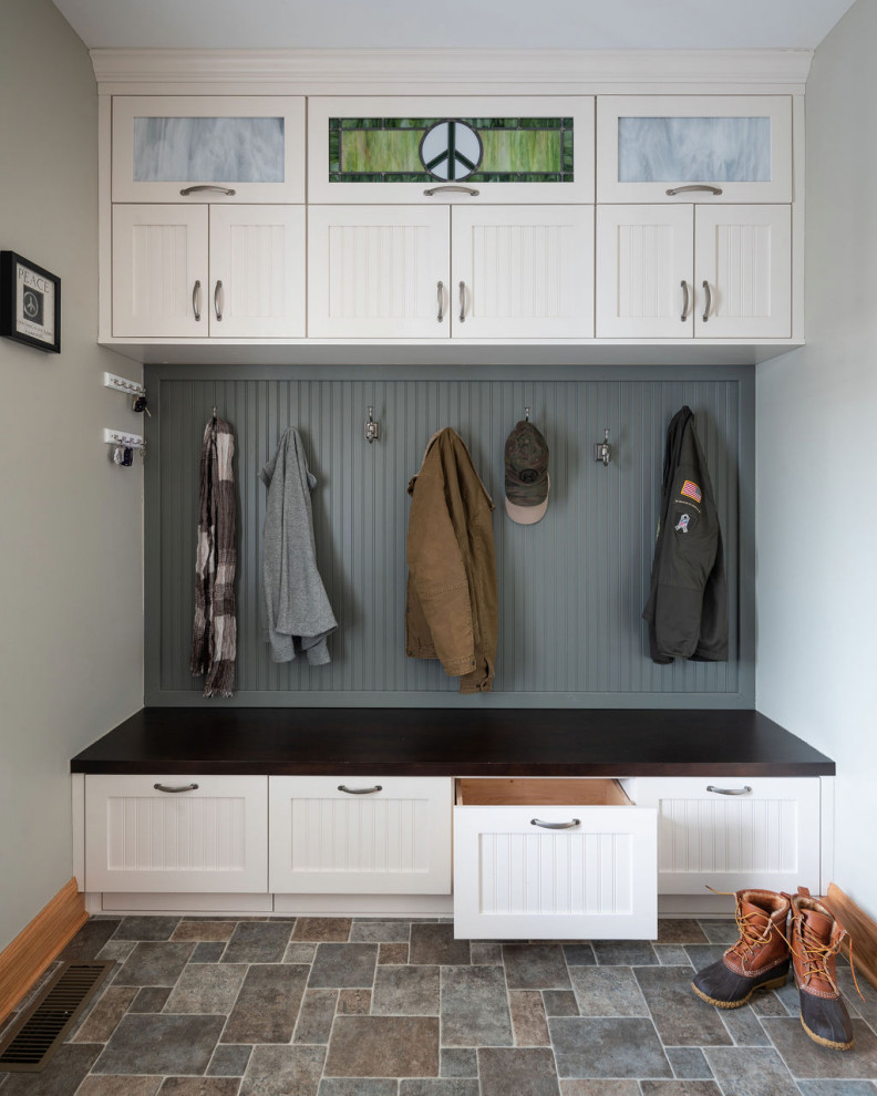 Inspiration for a mid-sized traditional mudroom in Columbus with vinyl floors and multi-coloured floor.