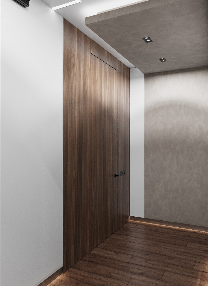 Идея дизайна: коридор среднего размера: освещение в современном стиле с серыми стенами, полом из ламината, коричневым полом, многоуровневым потолком и панелями на части стены