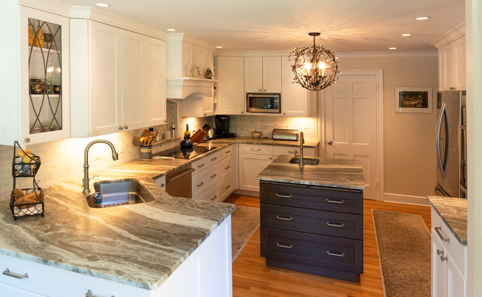 The classic white kitchen with a dark stained wood island ...