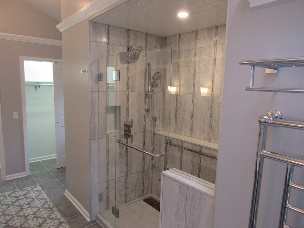 Large transitional master porcelain tile and gray floor double shower photo with gray walls and a hinged shower door