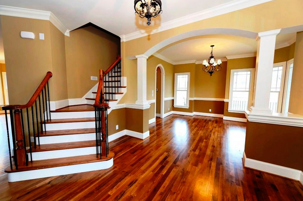 Inspiration for a mid-sized traditional foyer in Las Vegas with brown walls, dark hardwood floors and brown floor.
