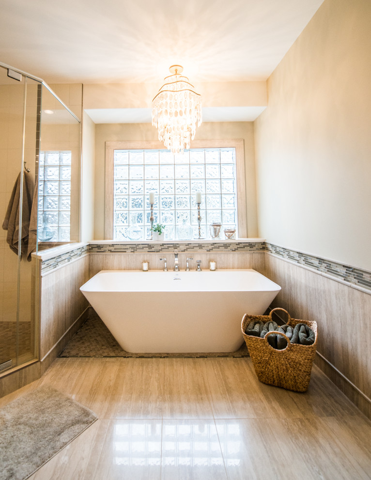 Inspiration for a large transitional master bathroom in Calgary with an undermount sink, shaker cabinets, white cabinets, engineered quartz benchtops, a freestanding tub, a double shower, beige tile, porcelain tile, beige walls and travertine floors.