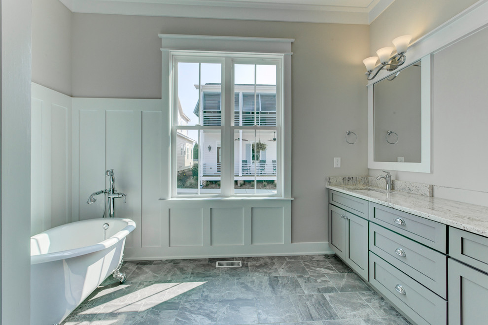 This is an example of a mid-sized country master bathroom in Raleigh with an undermount sink, shaker cabinets, grey cabinets, granite benchtops, a claw-foot tub, a curbless shower, a two-piece toilet, gray tile, ceramic tile, grey walls and ceramic floors.