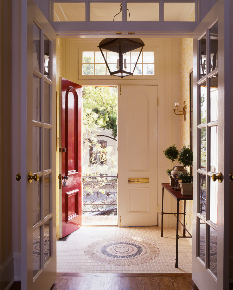 Entryway - small traditional marble floor entryway idea in DC Metro with beige walls