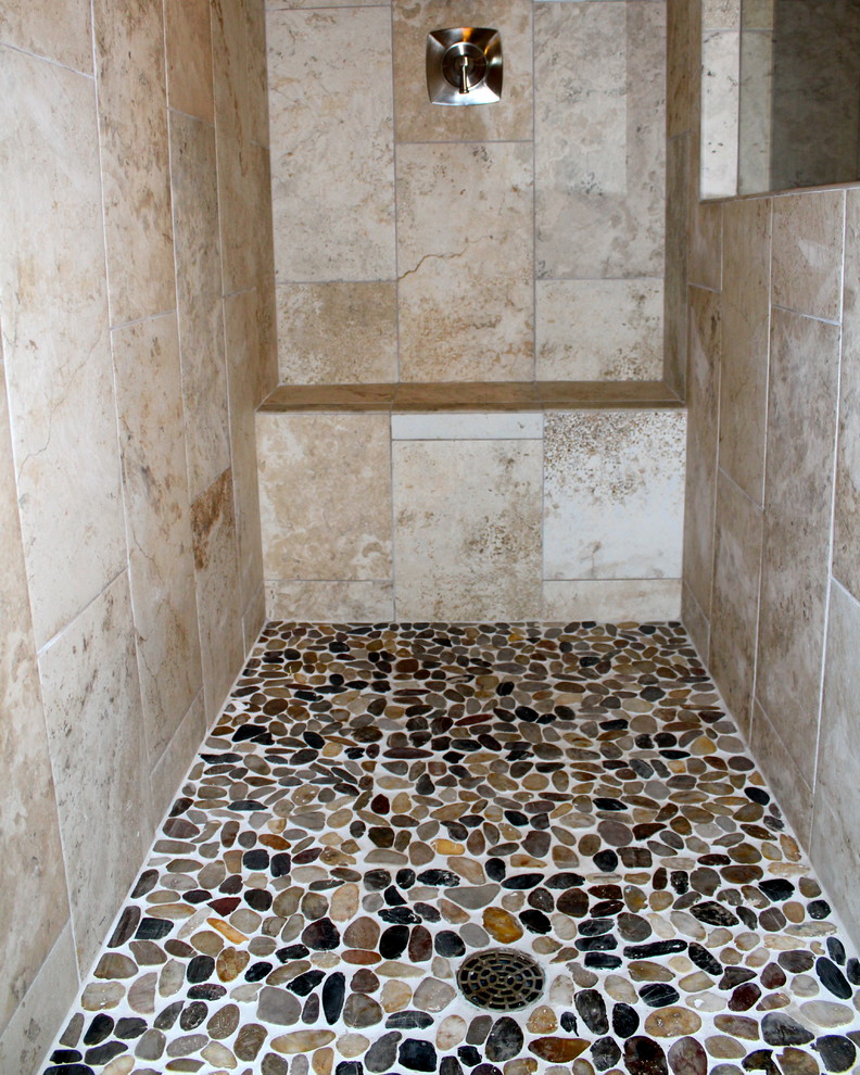 Design ideas for a transitional bathroom in Austin with pebble tile.