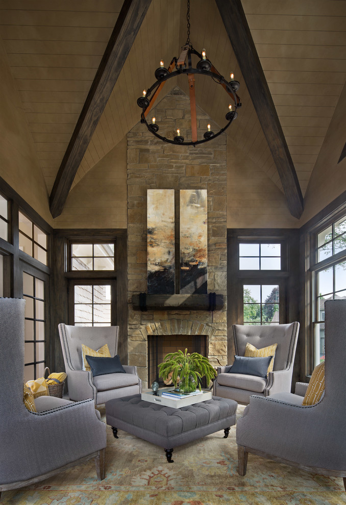 Inspiration for a transitional formal enclosed living room in Detroit with beige walls, a standard fireplace and a stone fireplace surround.