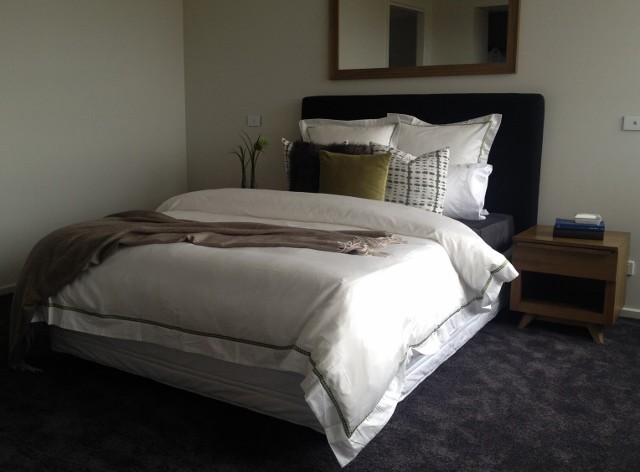 This is an example of a large modern bedroom in Geelong.