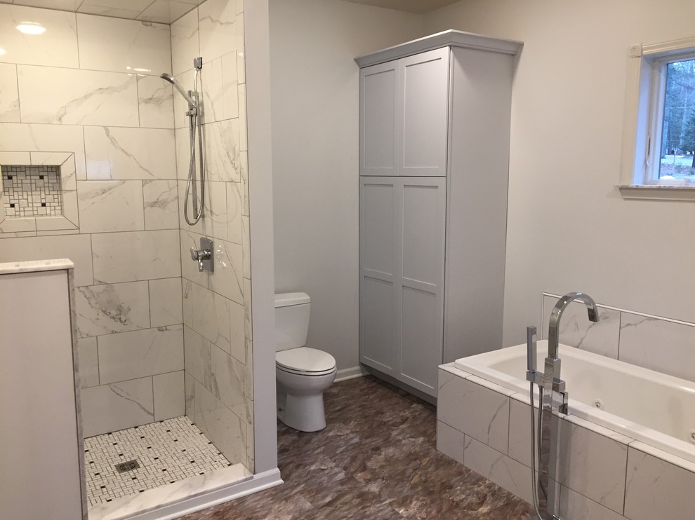 Photo of a mid-sized traditional bathroom in Other with shaker cabinets, blue cabinets, a hot tub, a curbless shower, a two-piece toilet, blue walls, vinyl floors, with a sauna, an undermount sink, engineered quartz benchtops, multi-coloured floor, a hinged shower door and white benchtops.