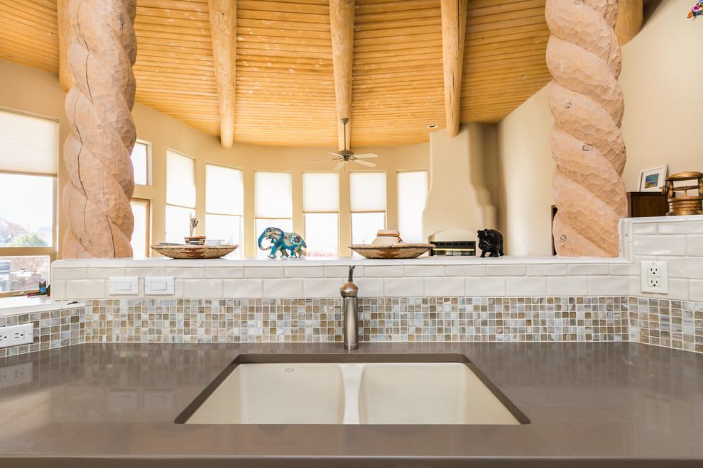 Inspiration for a large contemporary porcelain tile eat-in kitchen remodel in Albuquerque with a single-bowl sink, light wood cabinets, quartz countertops, multicolored backsplash, subway tile backsplash, stainless steel appliances and an island