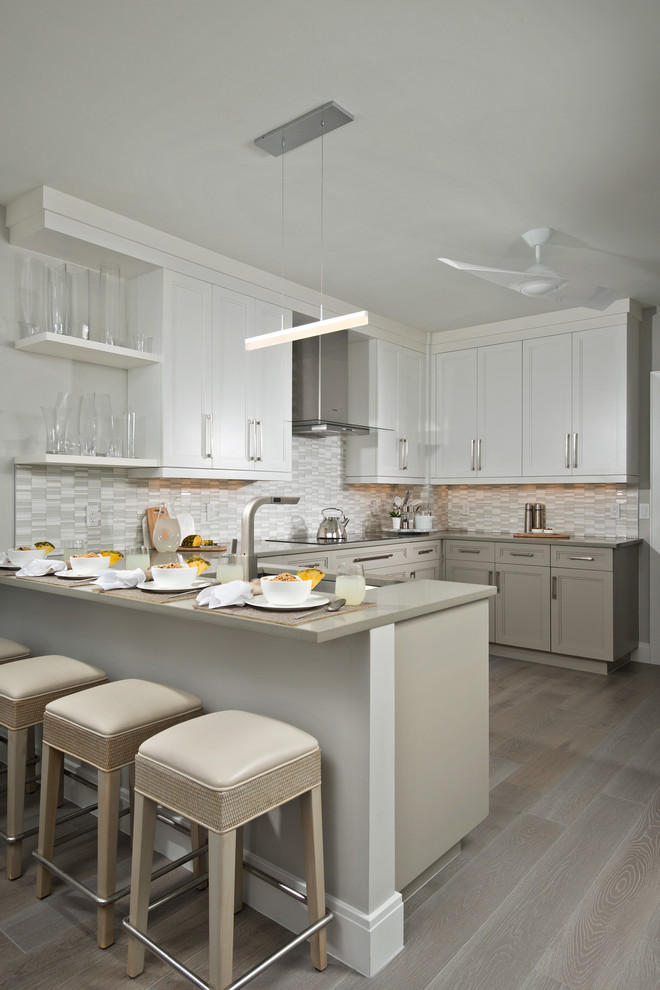 Transitional eat-in kitchen photo in Miami with raised-panel cabinets and white cabinets