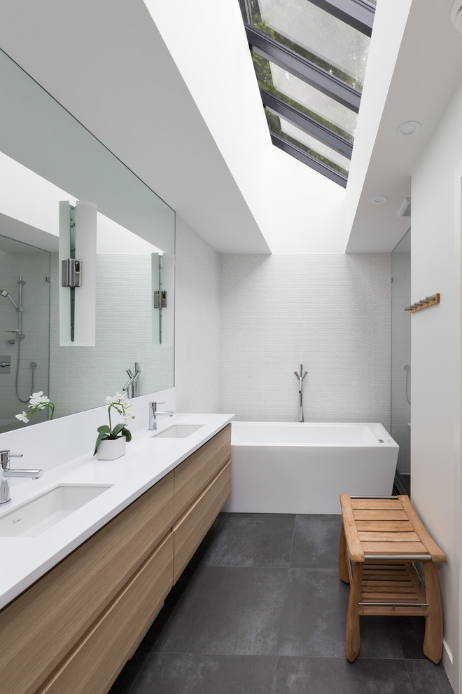 Design ideas for a large contemporary master bathroom in Vancouver with an undermount sink, flat-panel cabinets, light wood cabinets, engineered quartz benchtops, a freestanding tub, an open shower, white tile, porcelain tile, white walls and porcelain floors.