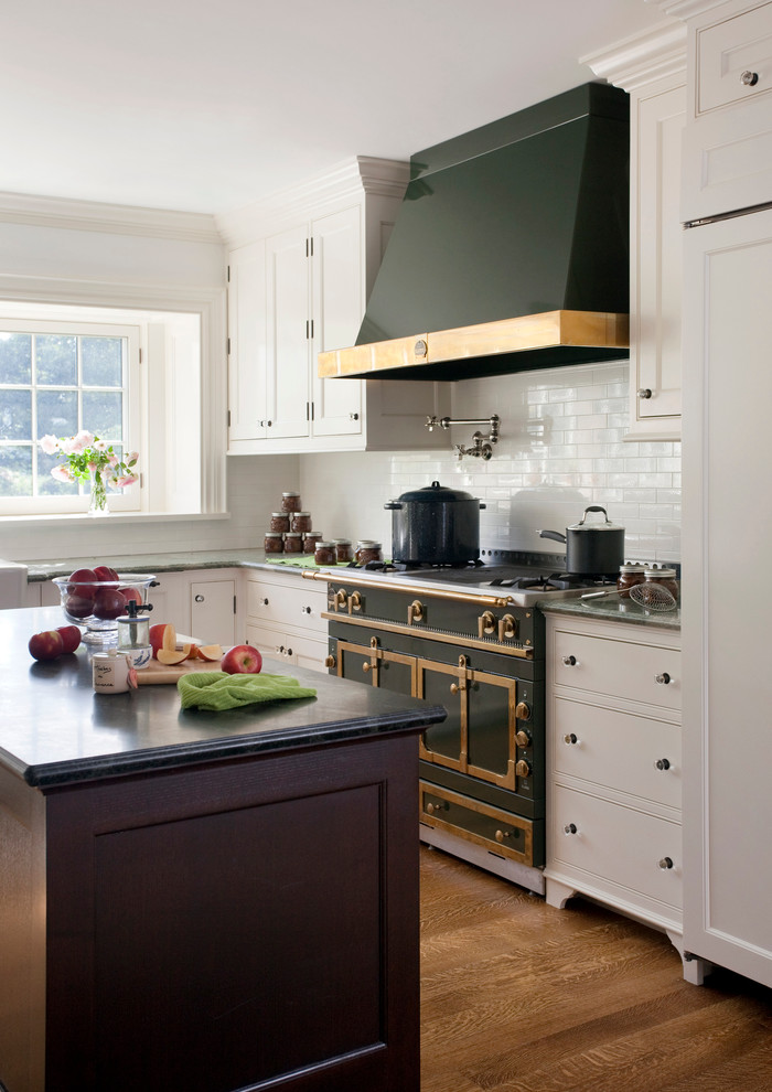 Example of a kitchen design in Boston with recessed-panel cabinets and white cabinets