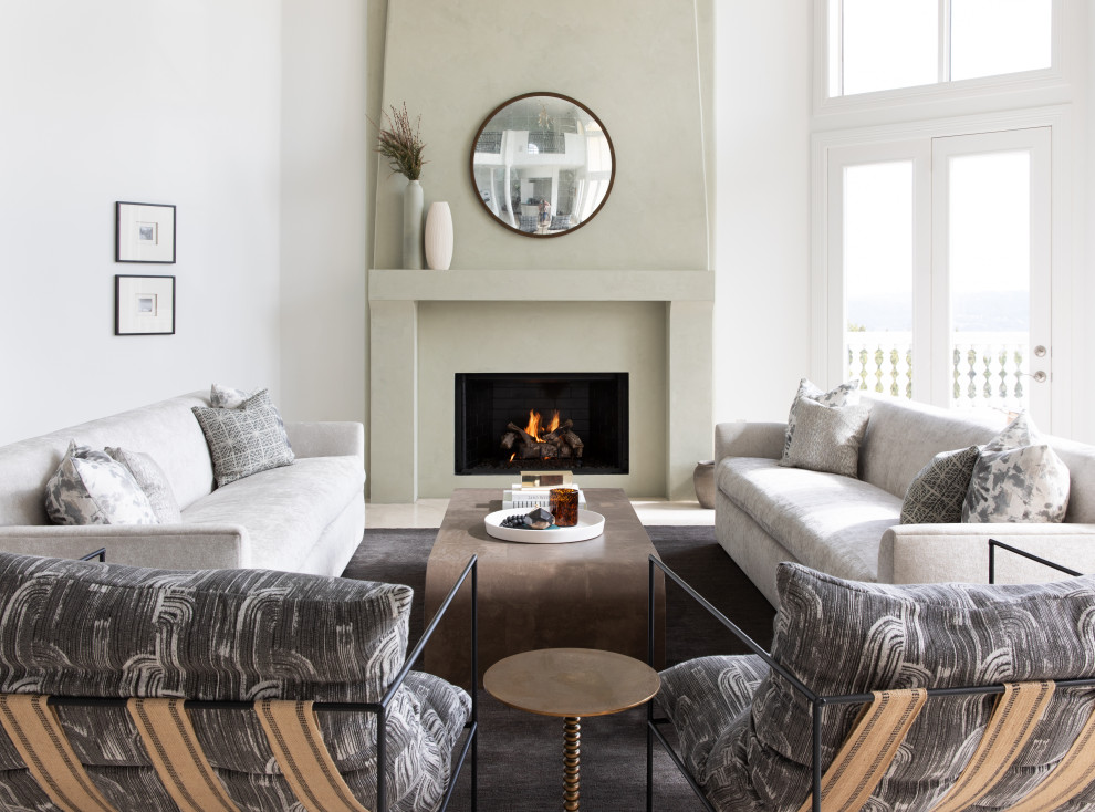 This is an example of a mid-sized contemporary formal open concept living room in Austin with white walls, a standard fireplace, a concrete fireplace surround and no tv.