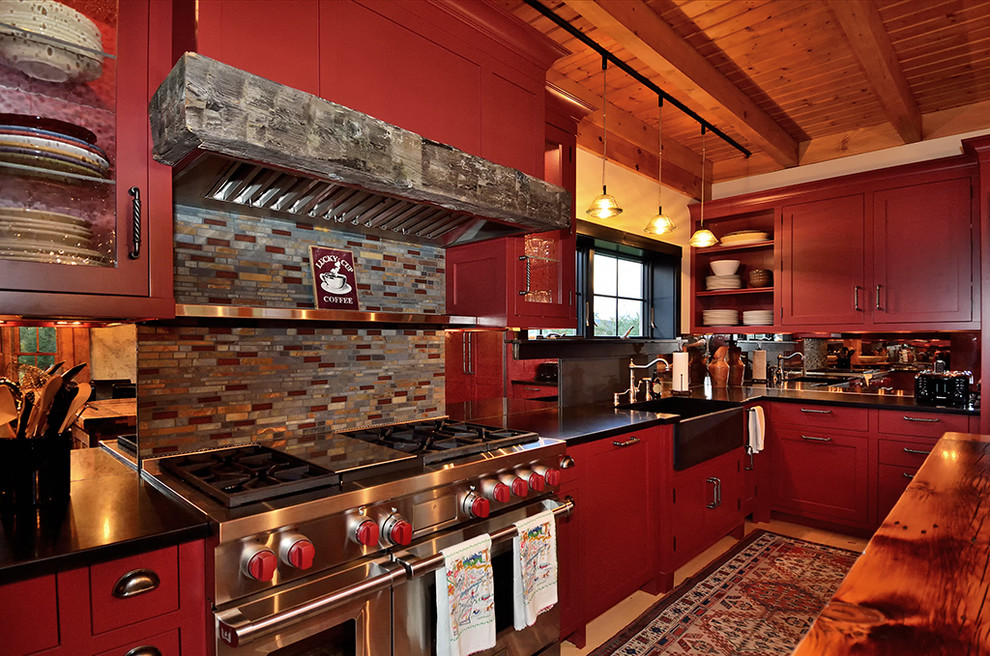 Inspiration for an expansive country u-shaped eat-in kitchen in New York with a farmhouse sink, recessed-panel cabinets, red cabinets, granite benchtops, multi-coloured splashback, mosaic tile splashback, stainless steel appliances, light hardwood floors and with island.