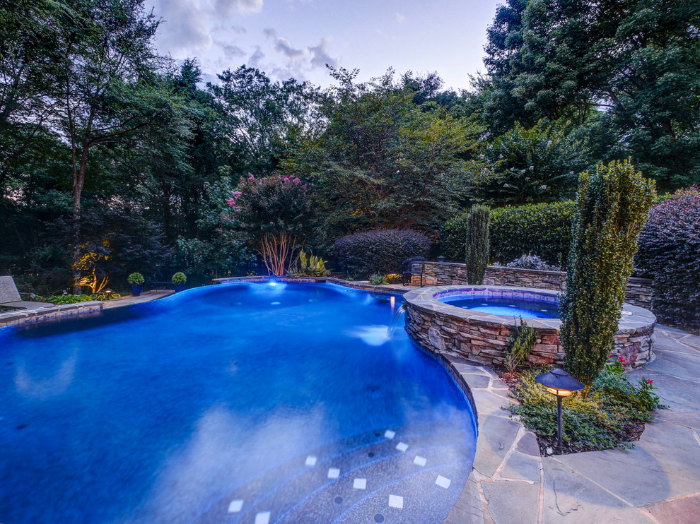 Design ideas for a traditional swimming pool in Charlotte.