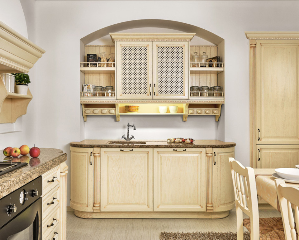 This is an example of a mid-sized traditional galley eat-in kitchen in Other with an undermount sink, recessed-panel cabinets, beige cabinets, marble benchtops, white splashback, black appliances, plywood floors and no island.