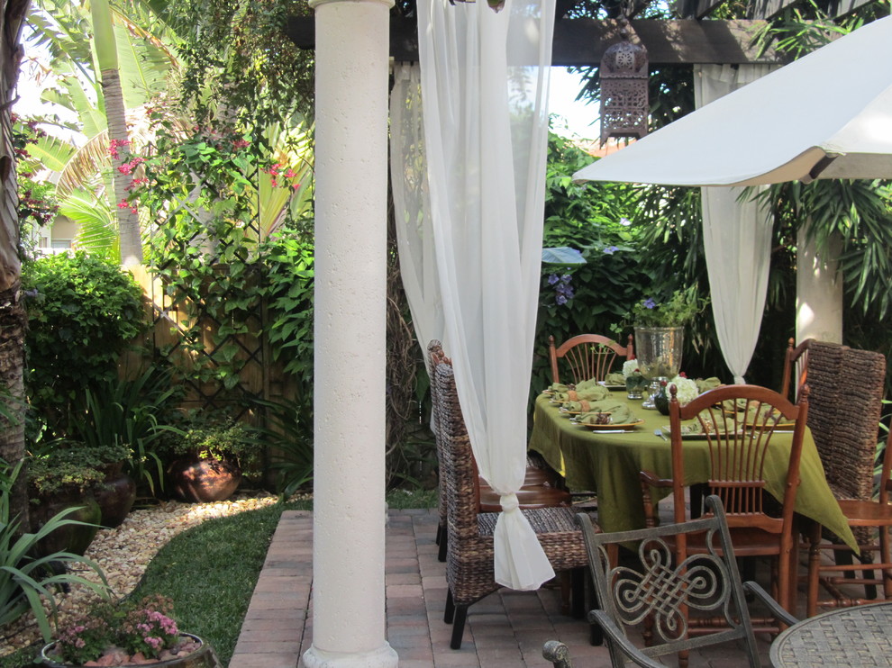 This is an example of a tropical patio in Other.