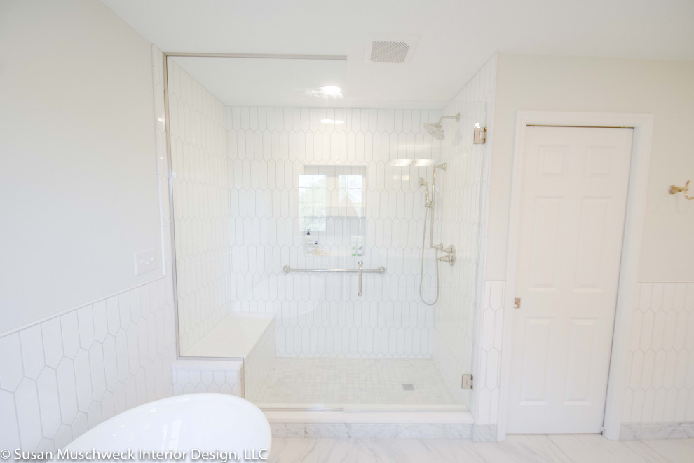 Large transitional master white tile and ceramic tile porcelain tile, white floor and double-sink freestanding bathtub photo with shaker cabinets, gray cabinets, white walls, an undermount sink, quartz countertops, a hinged shower door, white countertops and a built-in vanity