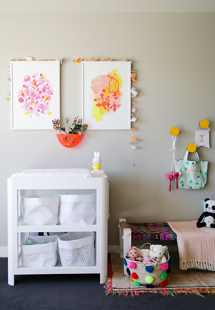 Design ideas for an eclectic gender-neutral nursery in Melbourne with black floor.