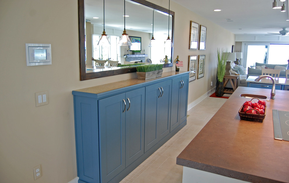 Inspiration for a large beach style u-shaped eat-in kitchen in Baltimore with shaker cabinets, with island, an undermount sink, stainless steel appliances, ceramic floors, blue cabinets and granite benchtops.